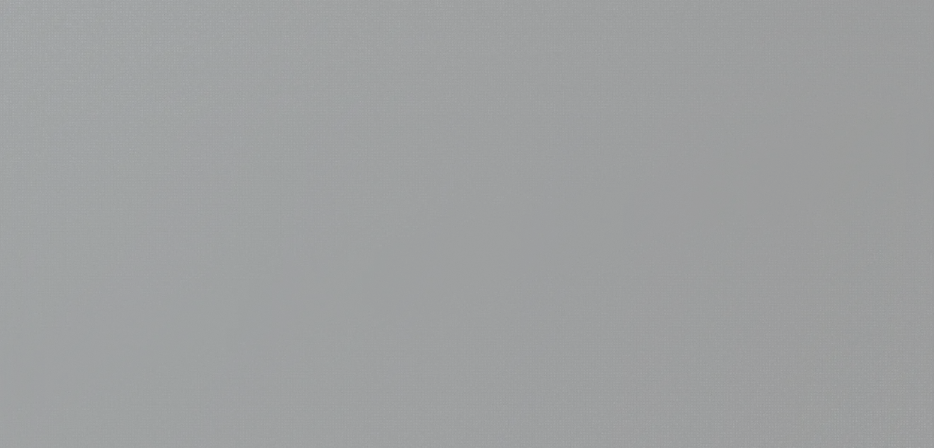 A spiraled notebook with a blue cover lies closed on a dark surface.